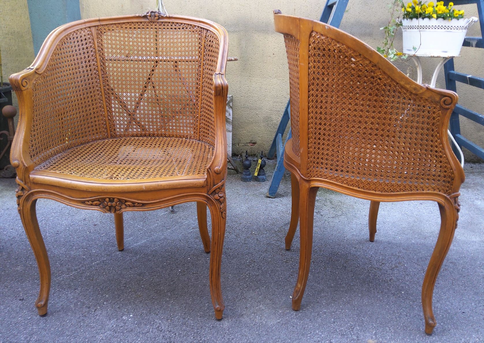 A pair of 'Bergères en Gondole' Desk Armchairs